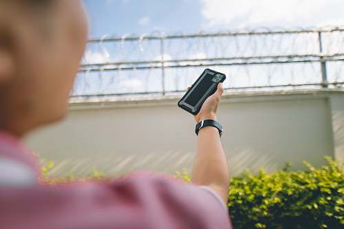 electronics person holding phone mobile phone
